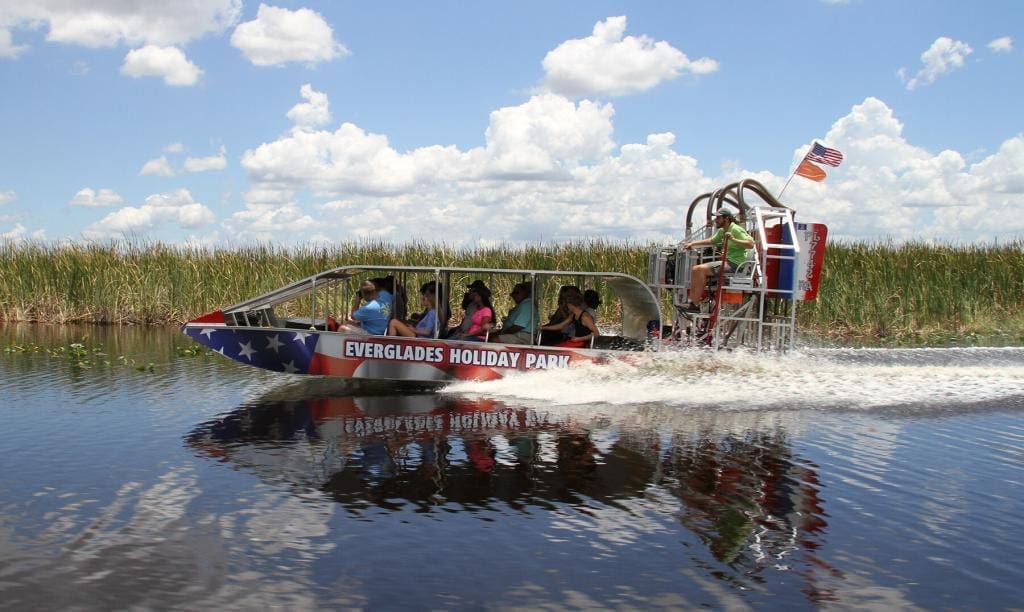 Star-Spangled Airboat Carrying Passengers on a Miami Everglades Tour